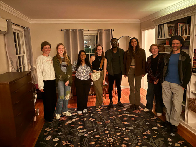 Lab group standing in a room, left to right: Talia, Molly, Israt, Bailey, Emmanuel, Aubrey, Scarlett, Geoff